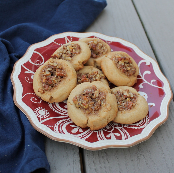 Pecan Pie Cookies feature a sweet shortbread cookie topped with classic pecan pie flavors. 