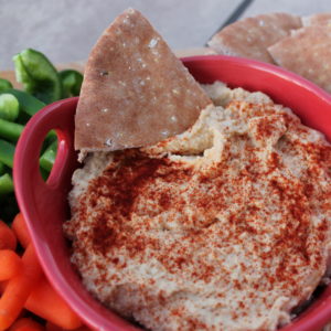With a slight kick from fresh garlic, homemade hummus is an easy, healthy munchie for snack or entertaining. Pair it with veggies, pitas, or pretzel chips for an irresistible snack.