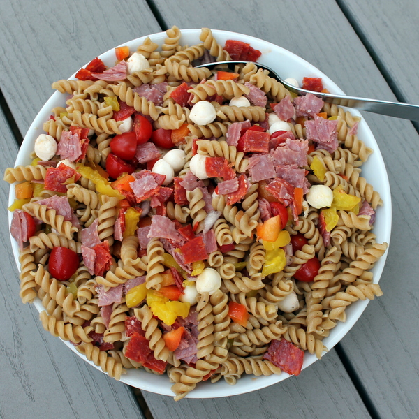  Salty, spicy Italian antipasto fixings are paired with fresh veggies and whole wheat pasta to create an Italian Antipasto Pasta Salad, a delicious side that's also hearty enough to enjoy for lunch.