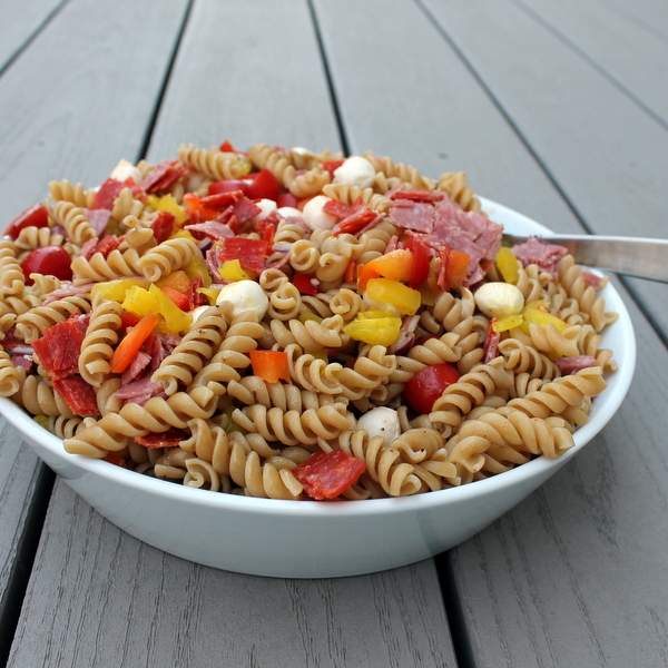  Salty, spicy Italian antipasto fixings are paired with fresh veggies and whole wheat pasta to create an Italian Antipasto Pasta Salad, a delicious side that's also hearty enough to enjoy for lunch.