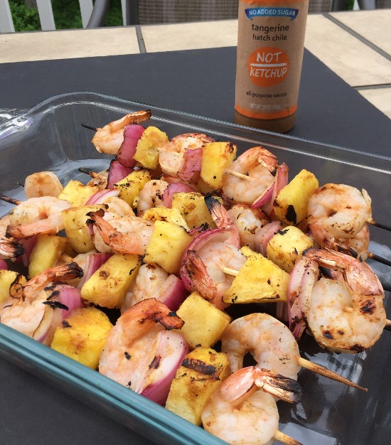 Shrimp and pineapple kabobs are brushed with a sweet and spicy BBQ sauce for a quick and flavorful weeknight meal.