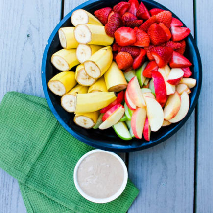 Lightly sweet Peanut Butter Chocolate Fruit Dip compliments fresh apple slices, bananas and strawberries for an indulgent and relatively healthy dessert.