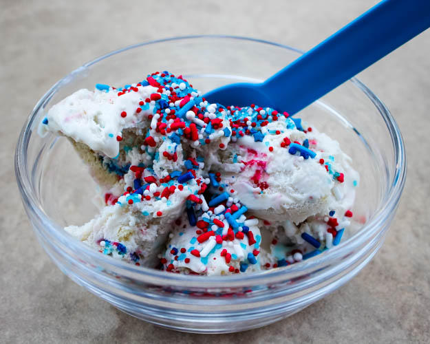 Red, White & Blue Funfetti Ice Cream - Homemade cake batter ice cream packed with festive sprinkles and crushed funfetti cookies brings a sweet, colorful treat to your summer celebrations.