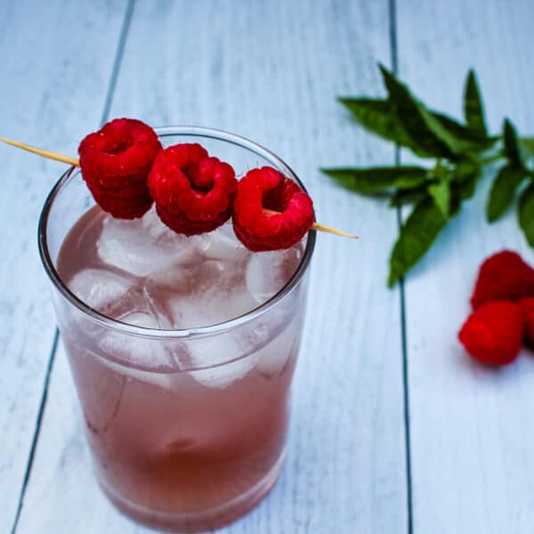 Light and sweet, this Raspberry Mojito is a delicious, minty cocktail to enjoy on a hot summer evening.