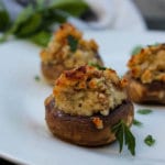 These Cheese-Stuffed Mushrooms are a long-time family favorite. Mushrooms are sauteed and then stuffed with Parmesan cheese, breadcrumbs, mushrooms and onions for a hearty, flavorful vegetarian appetizer that everyone will enjoy. 