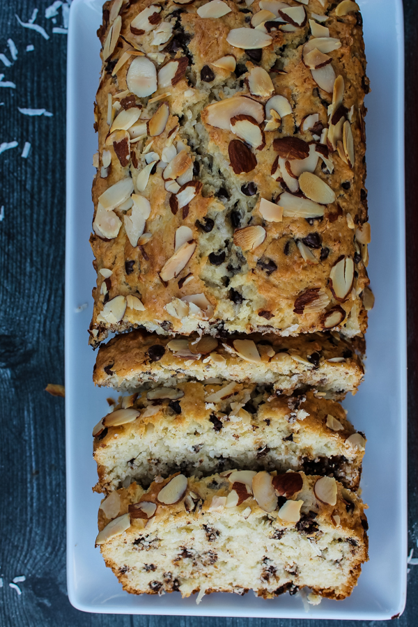 Overhead view of sliced Chocolate Coconut Almond Bread on a white plate