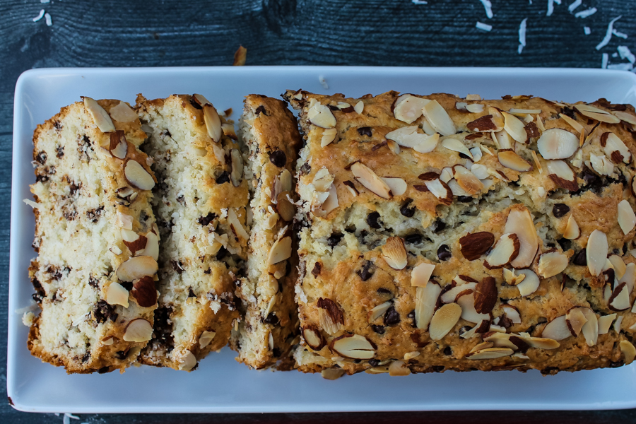 Overhead view of sliced Chocolate Coconut Almond Bread on a white plate