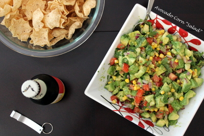 Avocado Corn Salad - Fresh, ripe summer veggies - avocado, corn, and tomatoes - are tossed with fresh herbs, a little jalapeno, and vinaigrette makings to create a summer side dish or poolside munchie that's simply irresistible. My favorite way to serve it? As a dip with tortilla chips! 