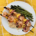 Shrimp and pineapple kabobs are brushed with a sweet and spicy BBQ sauce for a quick and flavorful weeknight meal.