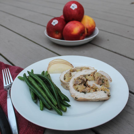 Tender turkey breast is stuffed with a sweet apple, cornbread and sausage stuffing for a satisfying, filling fall Sunday night dinner.
