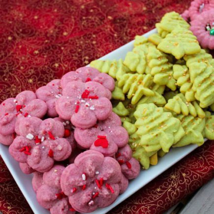 Classic Spritz are buttery, melt-in-your-mouth almond cookies - created in bright colors and topped with sprinkles - that are popular around Christmastime. These little cookies bring a fun bit of holiday cheer to lunchboxes, afternoon snacks or holiday dessert tables. 