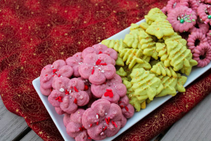 Classic Spritz are buttery, melt-in-your-mouth almond cookies - created in bright colors and topped with sprinkles - that are popular around Christmastime. These little cookies bring a fun bit of holiday cheer to lunchboxes, afternoon snacks or holiday dessert tables. 