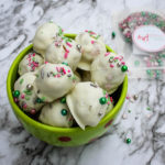 Sugar cookies are transformed into a truffle and coated with white chocolate candy melts and decorated with festive sprinkles, these Sugar Cookie Truffles are a hit with the kids this holiday season. 