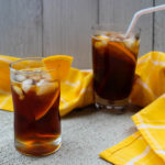 Unsweetened black tea is chilled and sweetened with Pimm's liquor and a little agave. With a splash of lemon juice and a wedge of your favorite citrus, this Pimm's Iced Tea is a sweet cocktail lovely for brunch or a warm afternoon sitting on the porch.