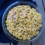 This easy, 4-ingredient Macaroni Salad is that classic mayo-based salad is a snap to put together and feeds a crowd. It’s our family’s favorite accompaniment to quick weeknight dinners on the grill, summer BBQs and potlucks, and big summer entertaining.