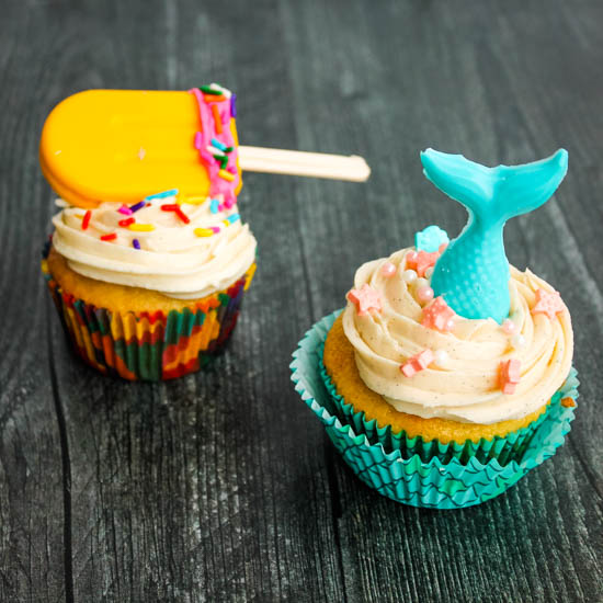 Cupcakes rich in vanilla flavor get a little bit of summer flair with candy mermaids and popsicles. Get the recipe for Vanilla Cupcakes with Vanilla Buttercream Frosting AND learn my secret to these easy and impressive decorations. 