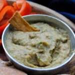 Baba Ganoush is an easy dip that highlights summer eggplant. Eggplant is gently roasted and then pureed, mixed with a few pantry staples as well as tahini, and served at room temperature for a healthy appetizer or snack.