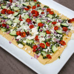 Shake up your appetizer game with this Mediterranean Layer Dip. Healthy, flavorful, and easy, this dip has proven to be a hit, again and again.