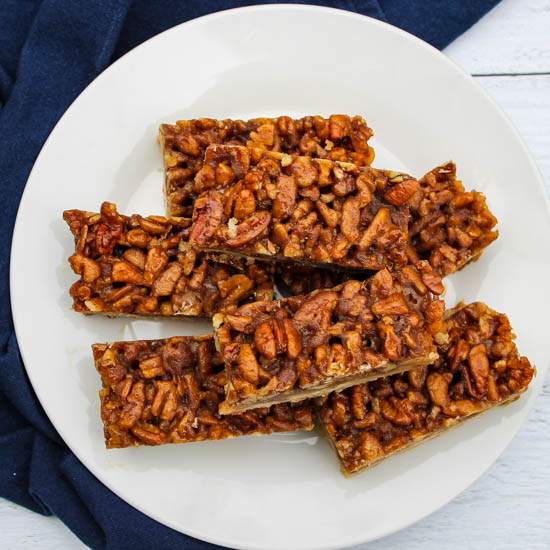 Shortbread topped with loads of sweet pecans have all the best flavors of pecan pie but served as a finger food perfect for fall and winter parties. Bonus: These Pecan Pie Bars make a ton and freeze beautifully, making it a great make ahead dessert for fall entertaining. 