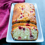 This easy loaf cake is full of bright flavors, thanks to tart cranberries and lemons. Topped with a sweet lemon glaze, this Lemon-Cranberry Cake will be a welcomed addition to any fall dessert table... or afternoon snack. 