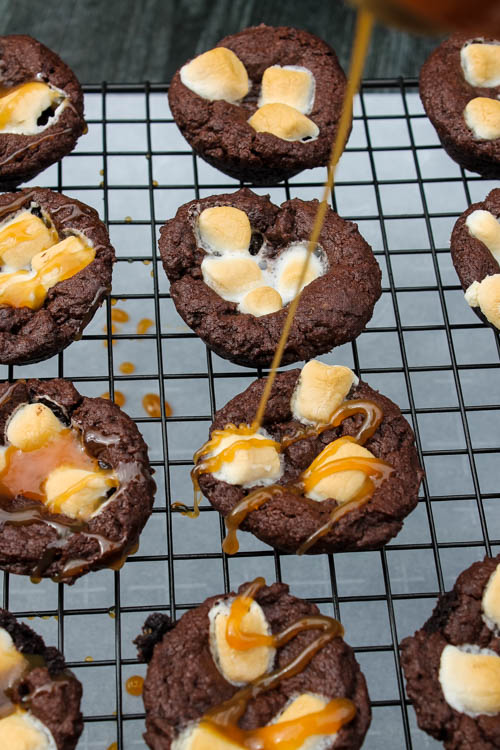 These Kahlua Hot Chocolate Cookies are a rich, decadent bite for your holiday dessert table. A soft pillow of chocolate, with a touch of Kahlua, topped with marshmallows and a caramel drizzle, what's not to love? 