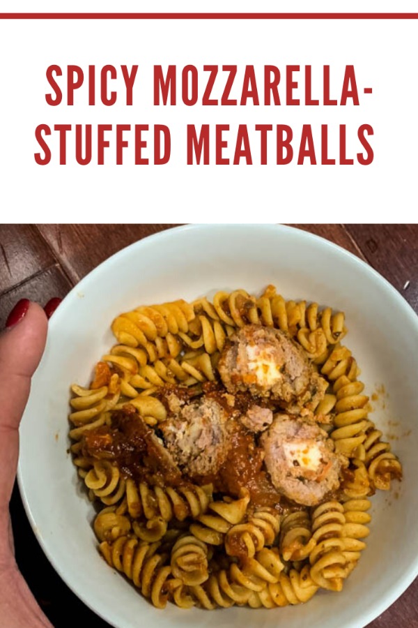 Mini-meatballs with just a bit of a kick are stuffed with mozzarella cheese for a hearty appetizer or comforting dinner on a cold day. 