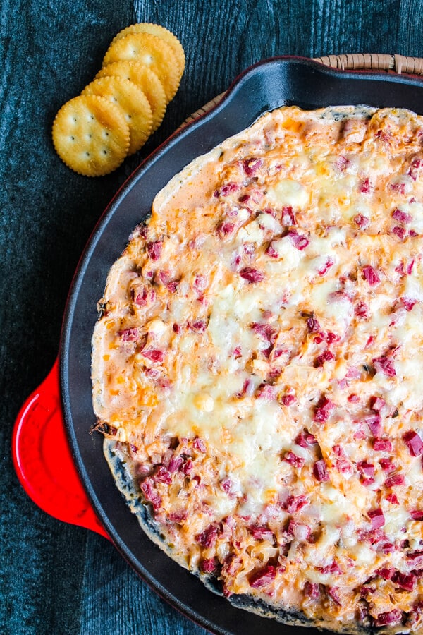 This Hot Reuben Dip tastes just like the sandwich. Corned beef, sauerkraut, Thousand Island dressing and Swiss cheese are mixed together and served piping hot - in a hearty dip great for fall and winter entertaining and game days. 