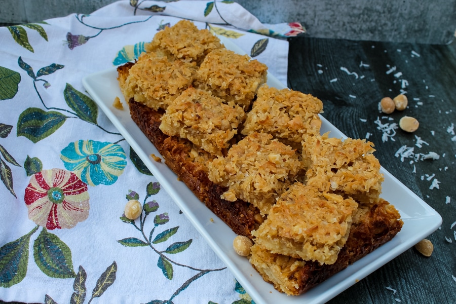 These Coconut Macadamia Nut Bars are an unexpected, bar cookie - a shortbread crust topped with a sweet and salty mix of coconut and macadamia nuts.