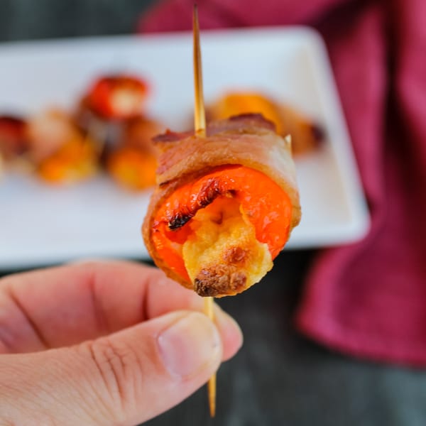 These Bacon-Wrapped Cheese-Stuffed Baby Bell Peppers were an irresistible little appetizer! Sweet baby bell peppers are stuffed with herbs and Italian cheeses and wrapped in applewood smoked bacon for a light but decadent feeling appetizer or snack.