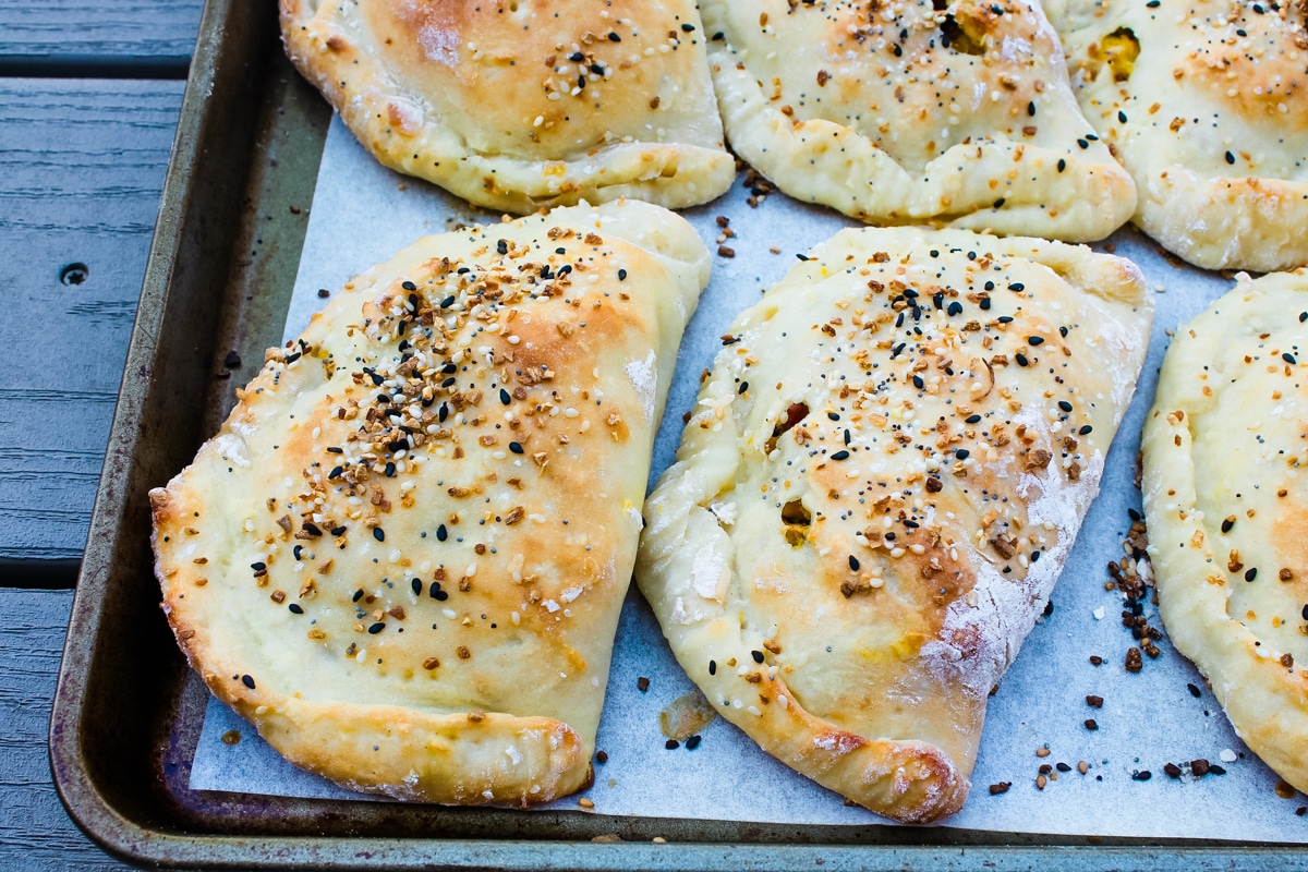 side view of Everything-but-the-Bagel Breakfast Pockets on a baking sheet