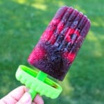 sangria popsicle against a green backdrop