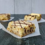 side view of sliced Chocolate Chip Cheesecake Bars