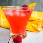 side view of a glass of Raspberry Lemonade Limoncello Cocktail