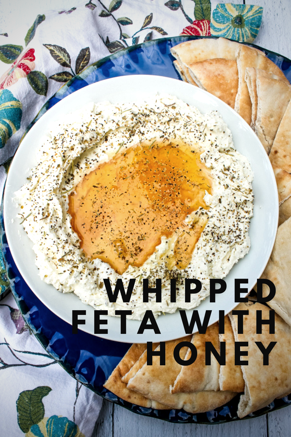 This Whipped Feta with Honey is simply irresistible. Salty herbed feta cheese is whipped and then topped with honey and more herbs for a snack you won't get enough of. 