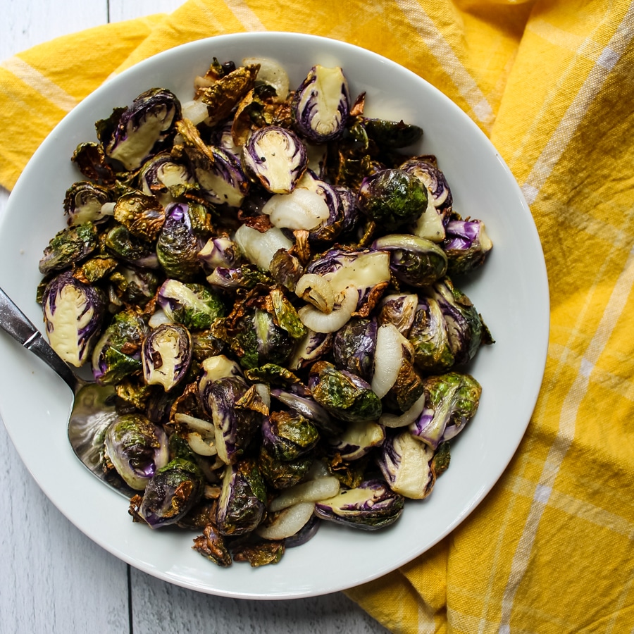 overhead view of a bowl of Air Fryer “Roasted” Brussels Sprouts