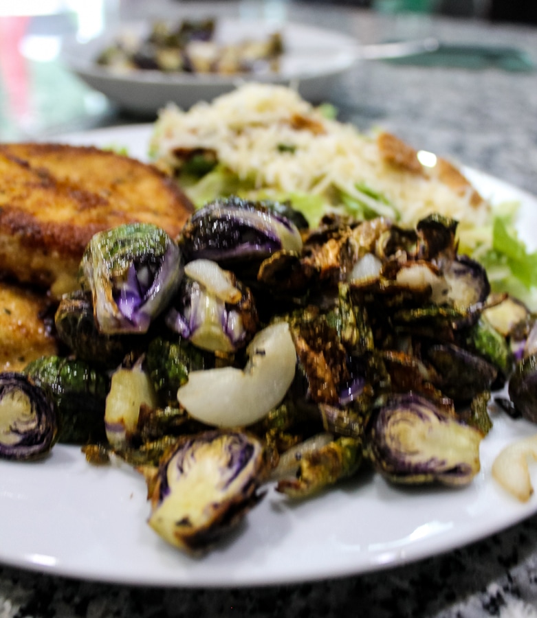 overhead view of Air Fryer “Roasted” Brussels Sprouts on a dinner plate