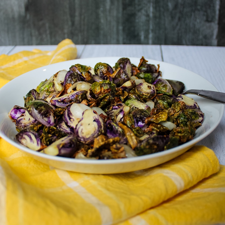 side view of a bowl of Air Fryer “Roasted” Brussels Sprouts